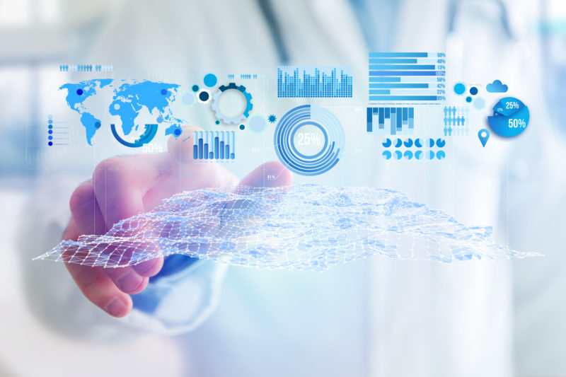 Business stats displayed as graph and chart on a futuristic interface - Business concept